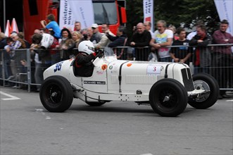 White antique racing car with the number 3 on a busy race track, SOLITUDE REVIVAL 2011, Stuttgart,