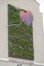 Marseille, Green wall with plants and a heart-shaped work of art in Marseille, Marseille,