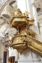 St Stephen's Cathedral, Passau, Golden baroque pulpit with angel sculptures and rich decorations,
