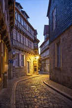 Narrow alley with half-timbered houses and cobblestones at Finkenherd in the historic old town at