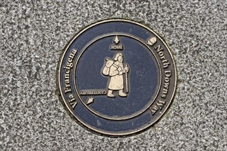 Plaque in the pavement showing the route of the Pilgrims' Way from Canterbury to Rome, North Downs