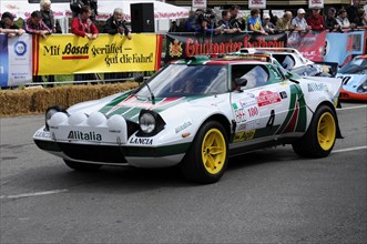 A Lancia Stratos rally car with Alitalia advertising at a racing event, SOLITUDE REVIVAL 2011,