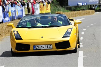 A yellow Lamborghini drives on a race track in front of spectators, SOLITUDE REVIVAL 2011,