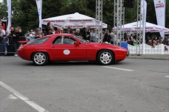 Side view of a red Porsche during a classic car race, SOLITUDE REVIVAL 2011, Stuttgart,