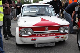 A white and red NSU hillclimb classic car stands in front of a crowd, SOLITUDE REVIVAL 2011,