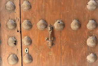 Alhambra, Granada, Andalusia, Old wooden door with shell decorations and traditional knocker,
