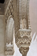 Artistic stone carvings, Alhambra, Granada, detail of an old Islamic building with fine stone