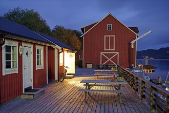 Wooden jetty with cosy wooden houses and benches, Rorbuer, holiday, fishing, Halsa, Kystriksveien,