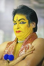 Kathakali performer or mime, 60 years old, with painted face, Kochi Kathakali Centre, Kochi,