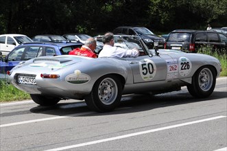 A silver vintage Jaguar is parked in a street car park, equipped for a race, SOLITUDE REVIVAL 2011,