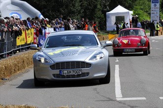 Silver Aston Martin leads a red Alfa Romeo in a classic car race, SOLITUDE REVIVAL 2011, Stuttgart,