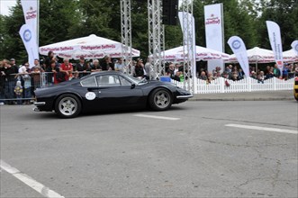 A black vintage Ferrari sports car presents itself at a road rally, SOLITUDE REVIVAL 2011,