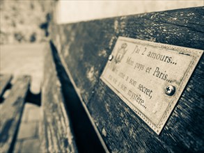 Sign on a bench, Alghero, Sardinia, Italy, Europe