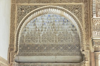 Artistic stone carvings, Alhambra, Granada, detail of a stucco decoration above an arch in