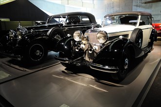 Museum, Mercedes-Benz Museum, Stuttgart, Black classic cars with chrome details in a museum,