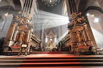 Speyer Cathedral, An impressive interior of a church with baroque altars and rays of light, Speyer