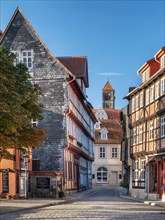 Narrow alley with half-timbered houses and cobblestones in the historic old town, behind the castle