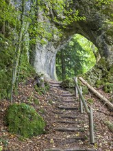 Hiking trail leads through a rock gate, Goessweinstein, Franconian Switzerland, Upper Franconia,