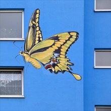 Sunflower house, painted swallowtail butterfly on a skyscraper, artist Ulrich Allgaier, Wuppertal,