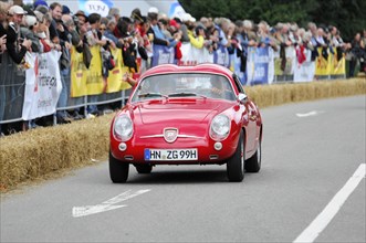 Red vintage sports car in a race with spectators, SOLITUDE REVIVAL 2011, Stuttgart,
