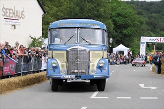 Mercedes-Benz O319, built in 1964, A blue vintage lorry from Mercedes-Benz takes part in a road