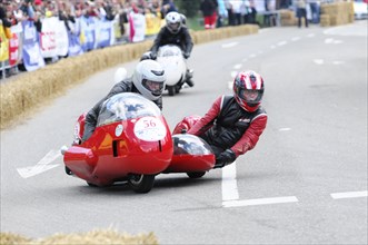 A motorbike with sidecar and concentrated racers on a race track, SOLITUDE REVIVAL 2011, Stuttgart,