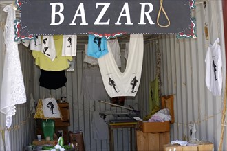Art Bazaar Marseille, A sign of the bazaar with hanging clothes in the entrance area, Marseille,