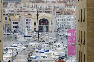 Marseille, View of a busy harbour with boats and surrounding buildings, Marseille, Departement