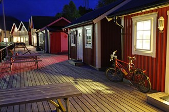 Bicycle standing in front of a cosy wooden hut on a jetty, Rorbuer, holiday, fishing, Halsa,