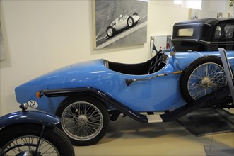 Deutsches Automuseum Langenburg, A blue classic racing car on display in a museum, Deutsches