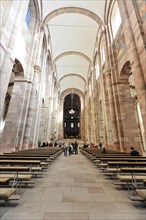 Speyer Cathedral, Wide church interior with visitors and an impressive pillar structure in