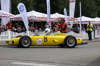 Yellow vintage racing car in action at a motorsport event, SOLITUDE REVIVAL 2011, Stuttgart,