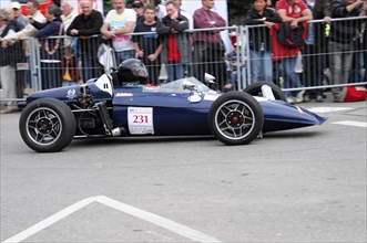 A blue formula racing car with the number 231 drives past spectators, SOLITUDE REVIVAL 2011,