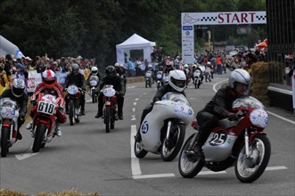 Motorcyclist at the starting line of a race with spectators in the background, SOLITUDE REVIVAL