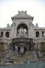 Palais Longchamp, Marseille, view of an imposing fountain with sculptures in front of a historic