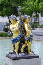 Marseille, Golden sculpture of two figures at a fountain, Marseille, Departement Bouches-du-Rhone,