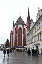 St Mary's Chapel, Market Square, Wuerzburg, Gothic church on a busy square in a European city,