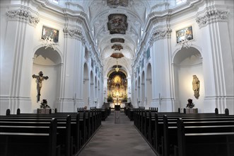 The Neumuenster Collegiate Abbey, Diocese of Wuerzburg, A bright baroque church interior with rows