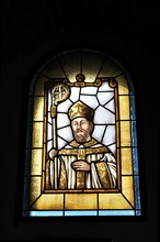 Castillo de Santa Catalina in Jaen, An artistic stained glass window with the portrait of a saint,