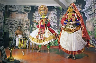 Kathakali performer or mime, 38 and 60 years old, and drummer on stage at the Kochi Kathakali