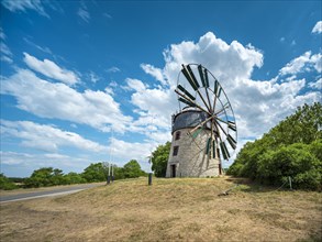 Old windmill under a clear blue sky with white clouds, tower windmill, Eckartsberga, Saxony-Anhalt,