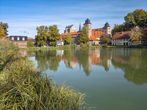 Thurnau Castle reflected in the castle pond, Thurnau, Upper Franconia, Bavaria, Germany, Europe