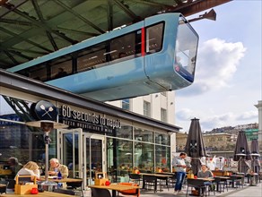 Suspension railway above the outdoor restaurant at the main railway station, Wuppertal, Bergisches