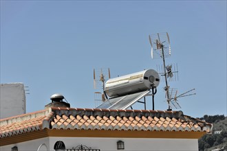 Solabrena, rooftop with antennas and a solar water heater against a clear sky, Costa del Sol,