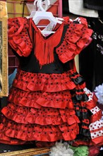 Granada, Colourful red flamenco dress with black dots and fringes, Granada, Andalusia, Spain,