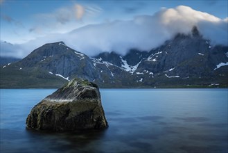 Landscape with sea and mountains on the Lofoten, view over the fjord Flakstadpollen to the