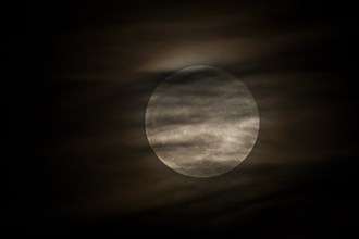 Full moon behind clouds, Braunschweig, Lower Saxony, Germany, Europe