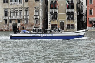 A boat on the water in Venice with the inscription 'Teatro La Fenice', Venice, Veneto, Italy,