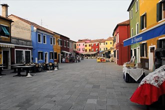Colourful houses, Burano, Burano Island, Lively shopping street with market stalls and colourful