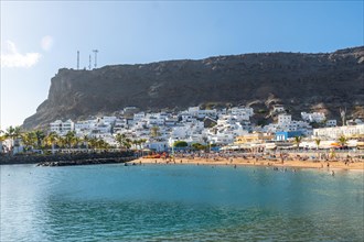 Seen from the beach of the touristic coastal town Mogan in the south of Gran Canaria in summer.
